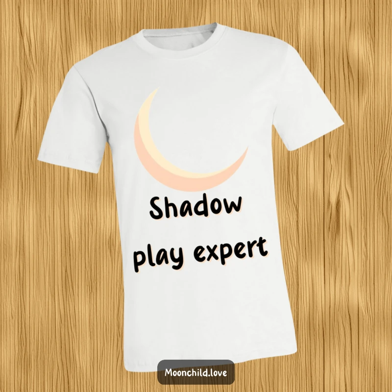Funny geometric crescent moon silhouette casting bold shadows, creating a mysterious and humorous design on a t-shirt.